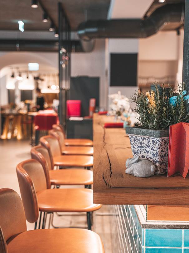 Leather bar stools stand in front of the counter